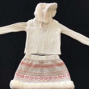 Two piece matching hoodie and skirt set.